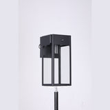 Black framed glass wall light with E26 socket, unlit, with the GFCI outlet box at the top